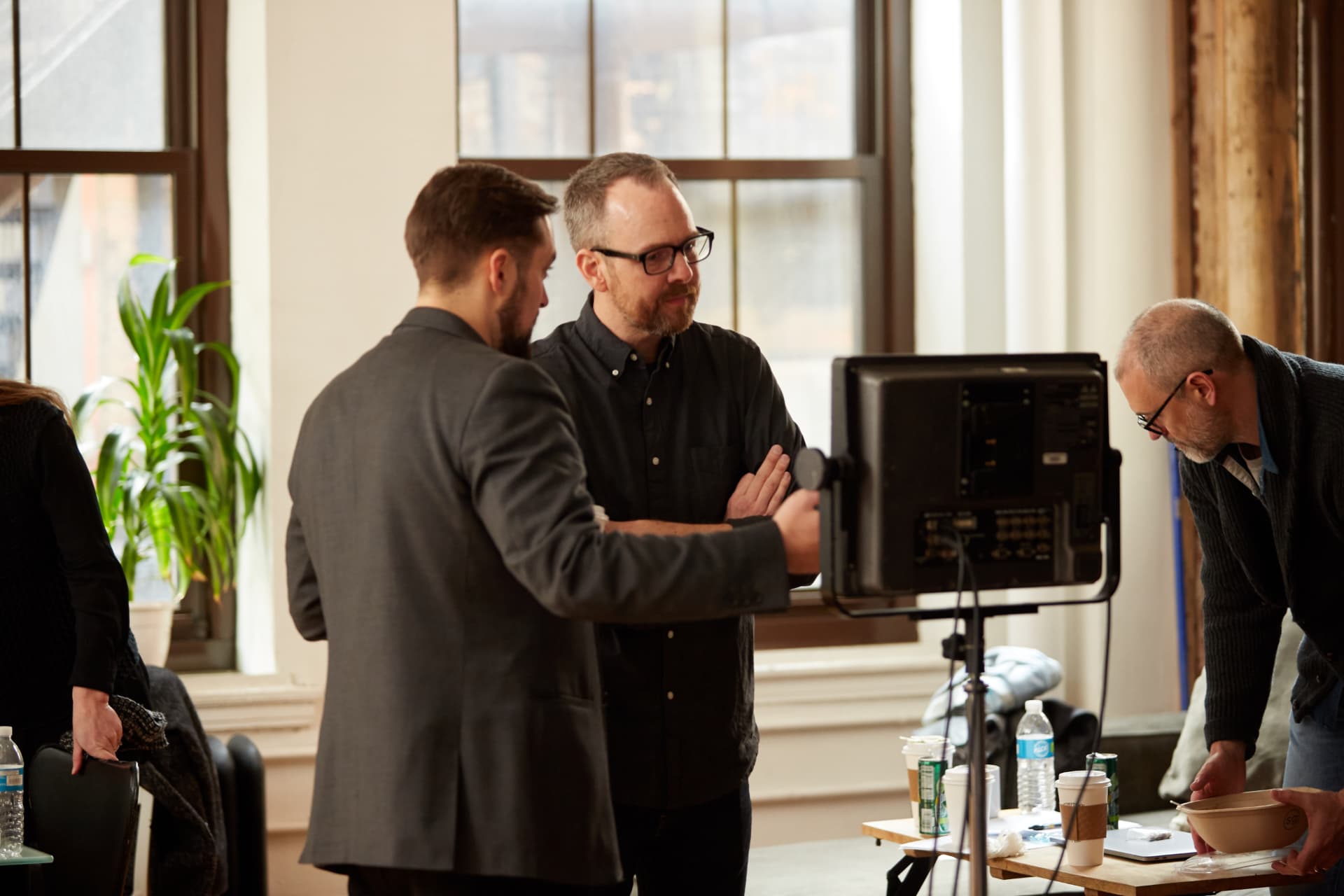On set with lead producers, reviewing a shot during a HearingFirst documentary shoot