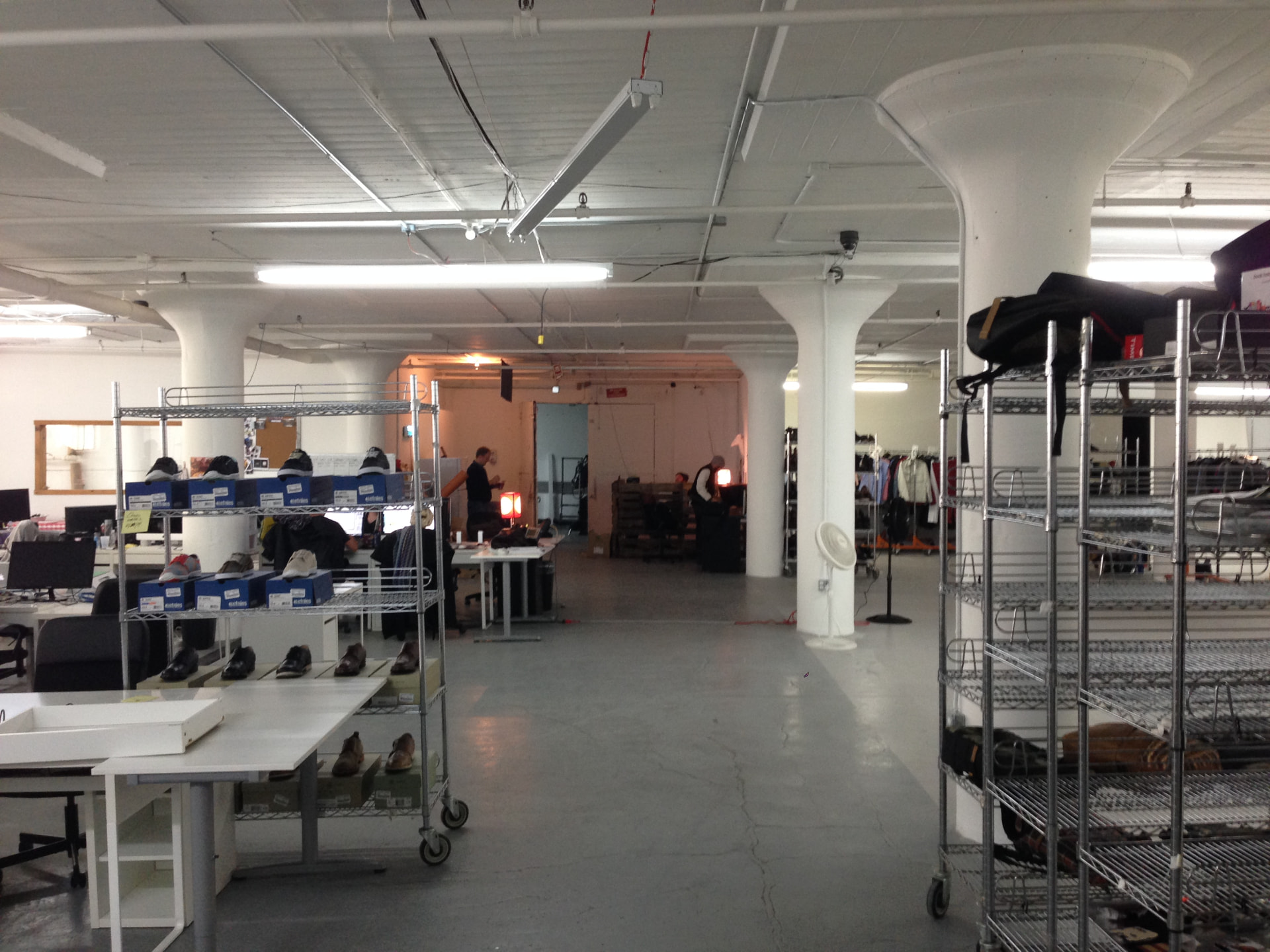 Sample racks and shoe styling tables in the Brooklyn Navy Yard space