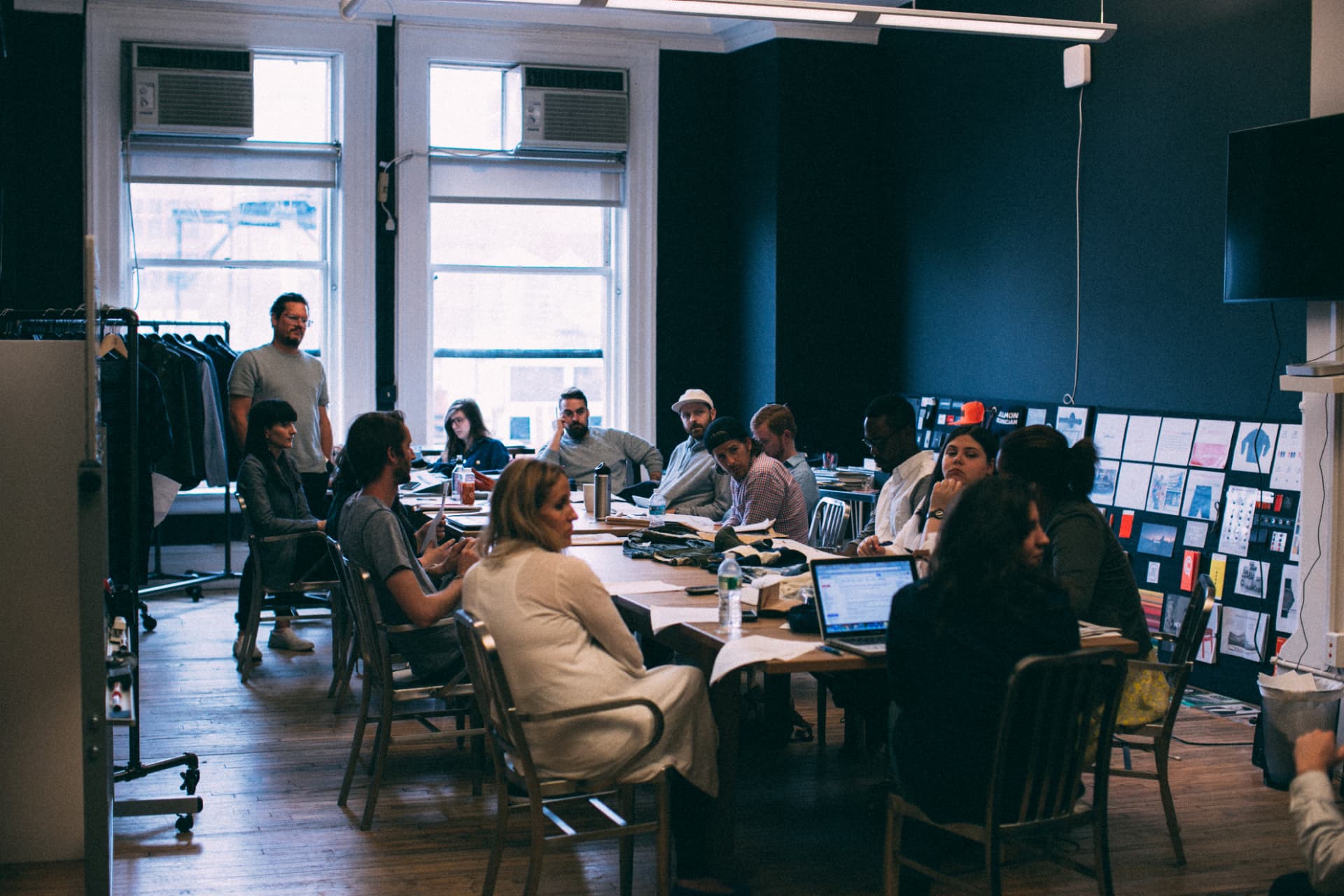 The JackThreads team gathered around a long table in the SoHo office